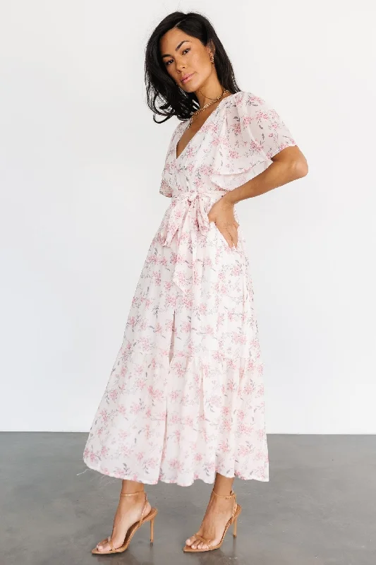 Midi dresses with asymmetric hems for a fashion - forward and dynamic appearance Iris Midi Dress | Blush Floral Midi dresses with asymmetric hems for a fashion - forward and dynamic appearance Iris Midi Dress | Blush Floral