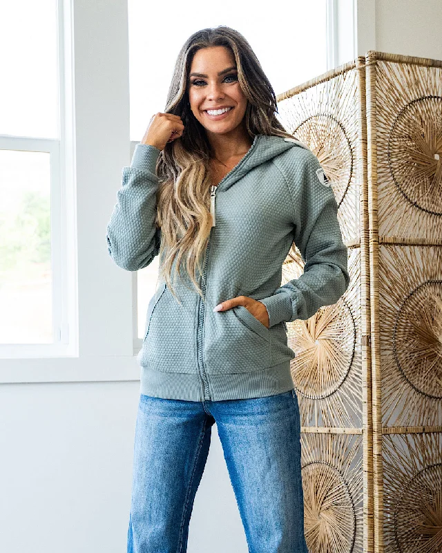 Women's zip - front sweatshirt with contrast stitching for a sporty aestheticWanakome Xera Full Zip Hoodie - Flint Women's zip - front sweatshirt with contrast stitching for a sporty aestheticWanakome Xera Full Zip Hoodie - Flint
